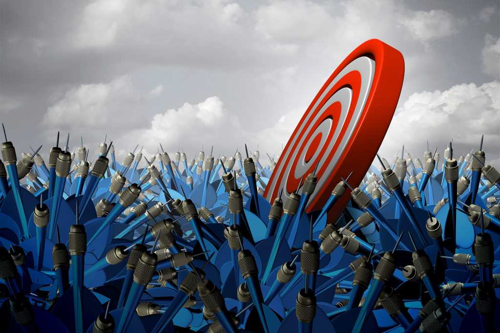 A target floats aimlessly in an ocean of missed darts.
